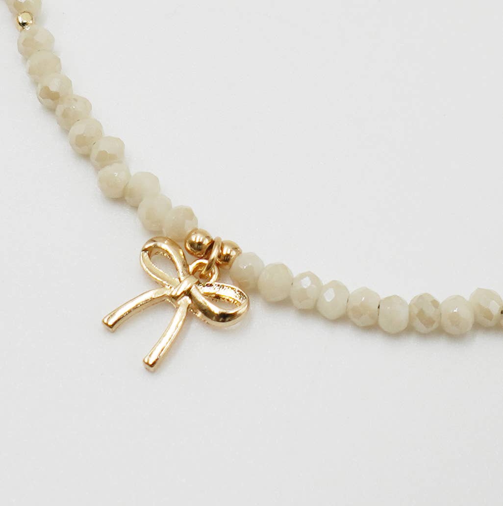 Ivory Bead & Gold Bow Charm Necklace